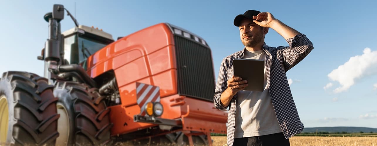 Man in field discovering DMS with his tractor