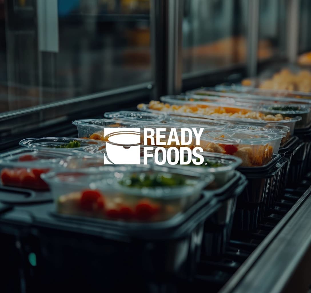 Ready Foods logo with a background of food in containers